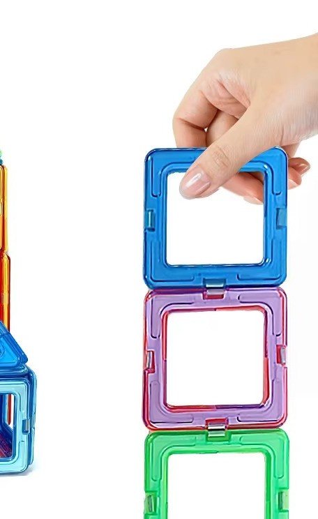 Hand assembling magnetic building blocks